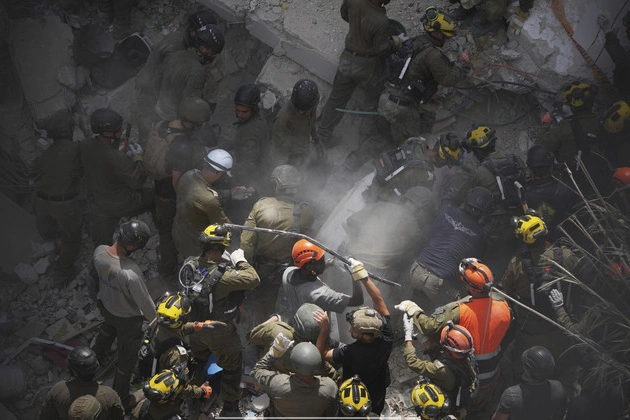death_toll_grows_as_israel_and_iran_trade_attacks_for_third_day